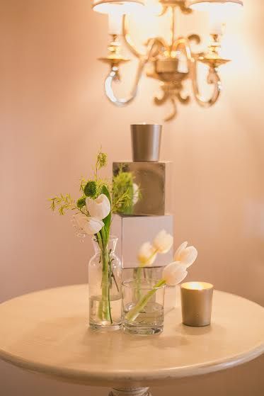 Photo of White Tulips and Gold Candles Decor
