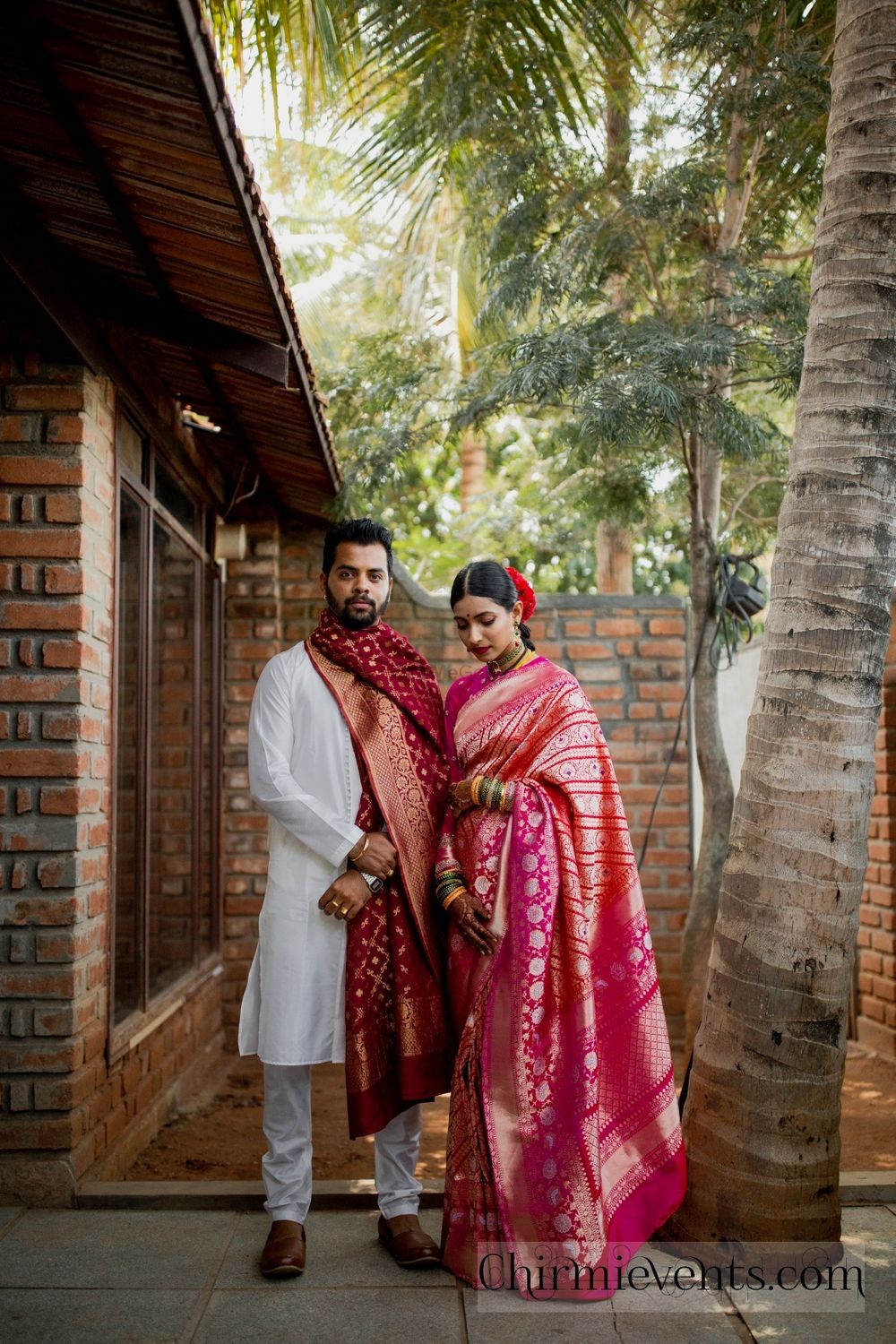 Photo of A couple in coordinated outfits for their wedding