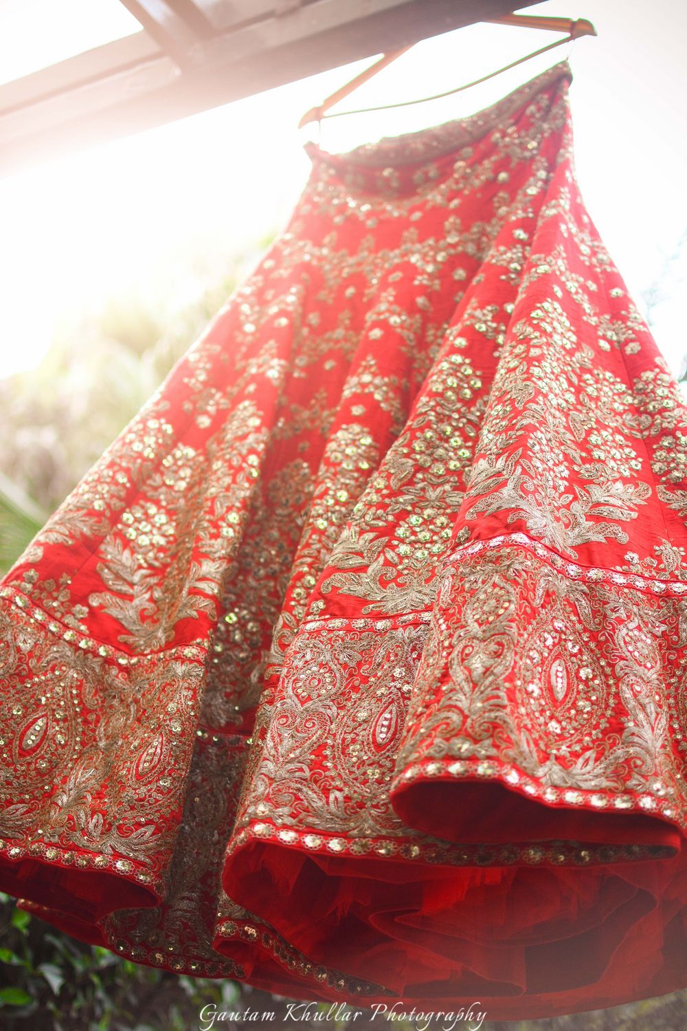 Photo of Red and gold bridal lehenga with mirror work