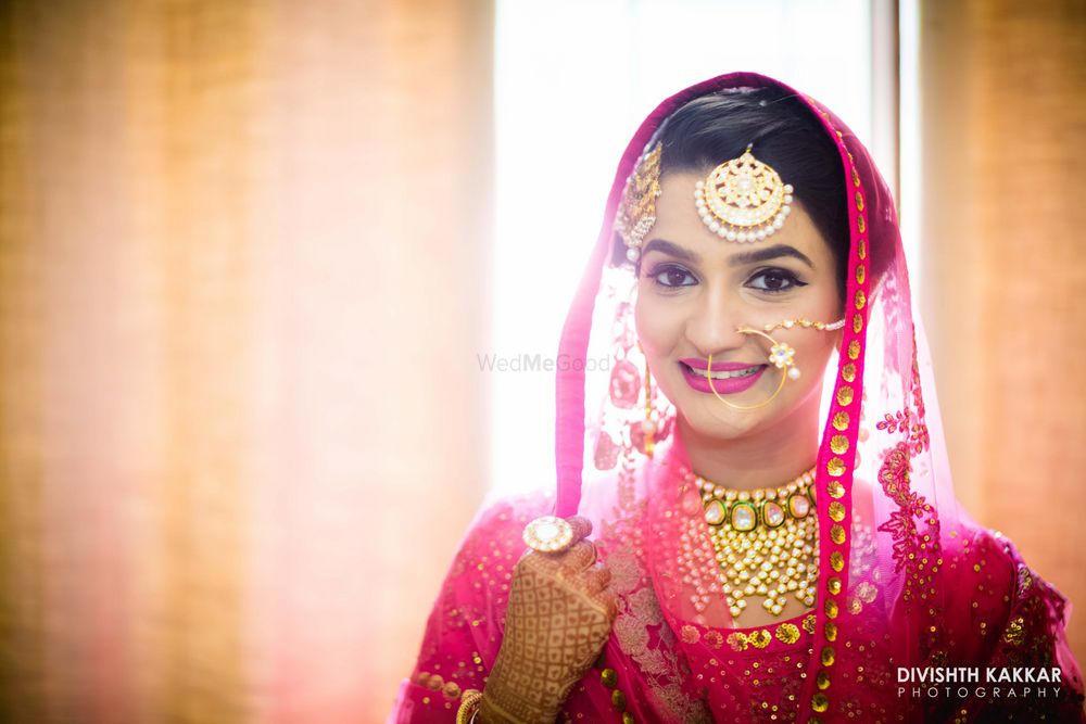 Photo of Pink Bride with Gold Choker and Maangtikka