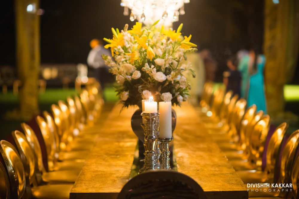 Photo of Yellow Flowers and Candles - Table Centerpiece