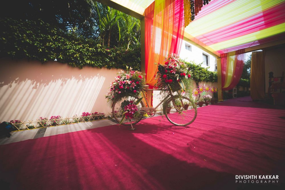 Photo of Colorful Tents with FLoral Bicycle Props