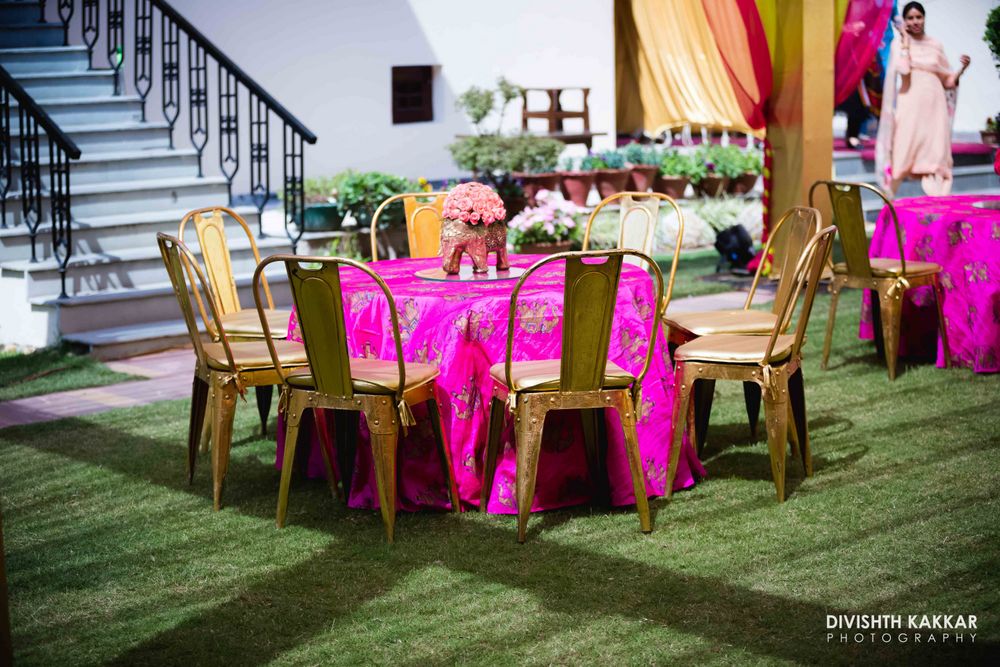Photo of Fuchsia Pink Table with Gold Seating