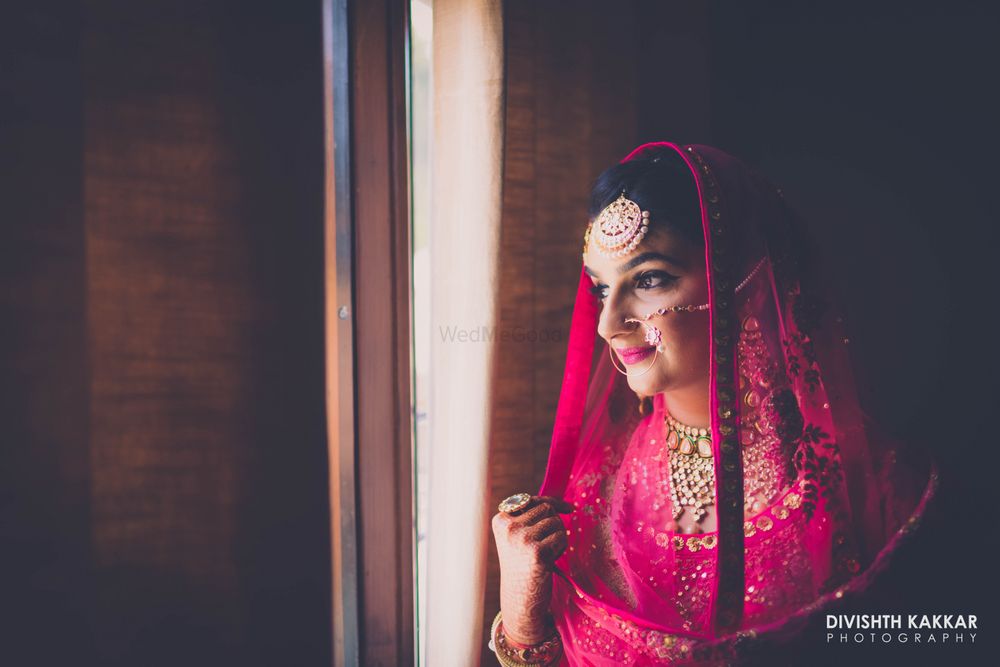 Photo of Pink Bridal Portrait with Gold Maangtikka