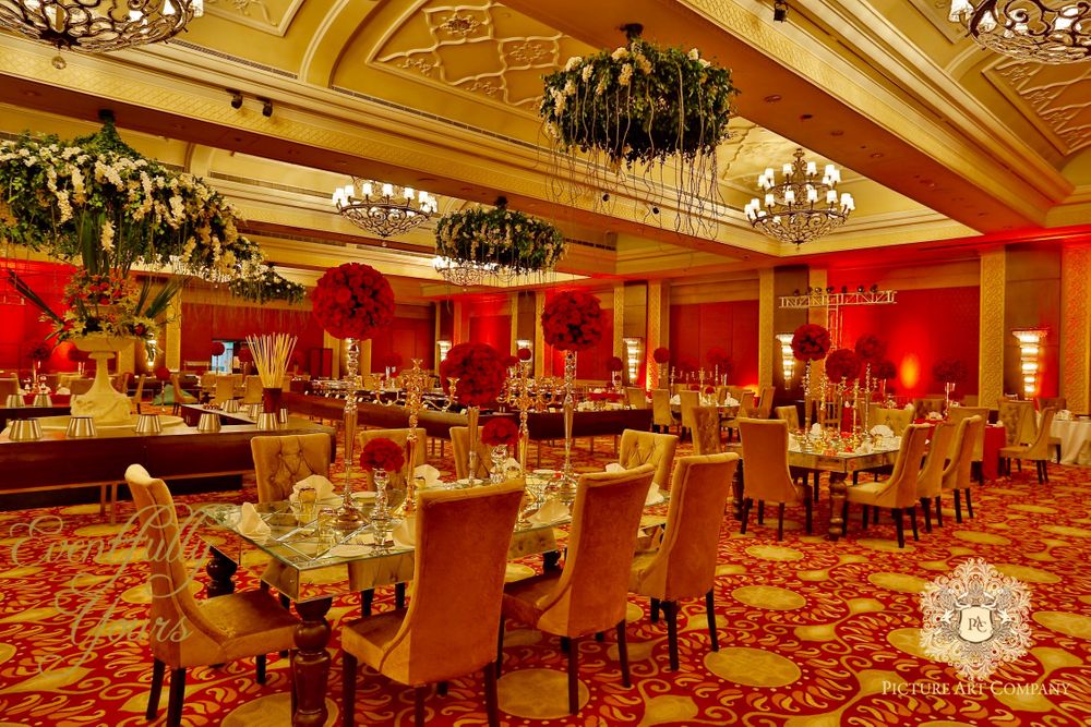 Photo of Red and Gold Theme Decor with Floral Chandeliers