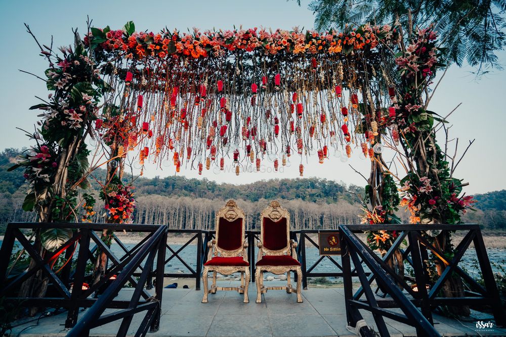 Photo of rustic mandap by the riverside