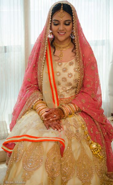 Photo of Cream and Gold Lehenga with Blush Pink Dupatta