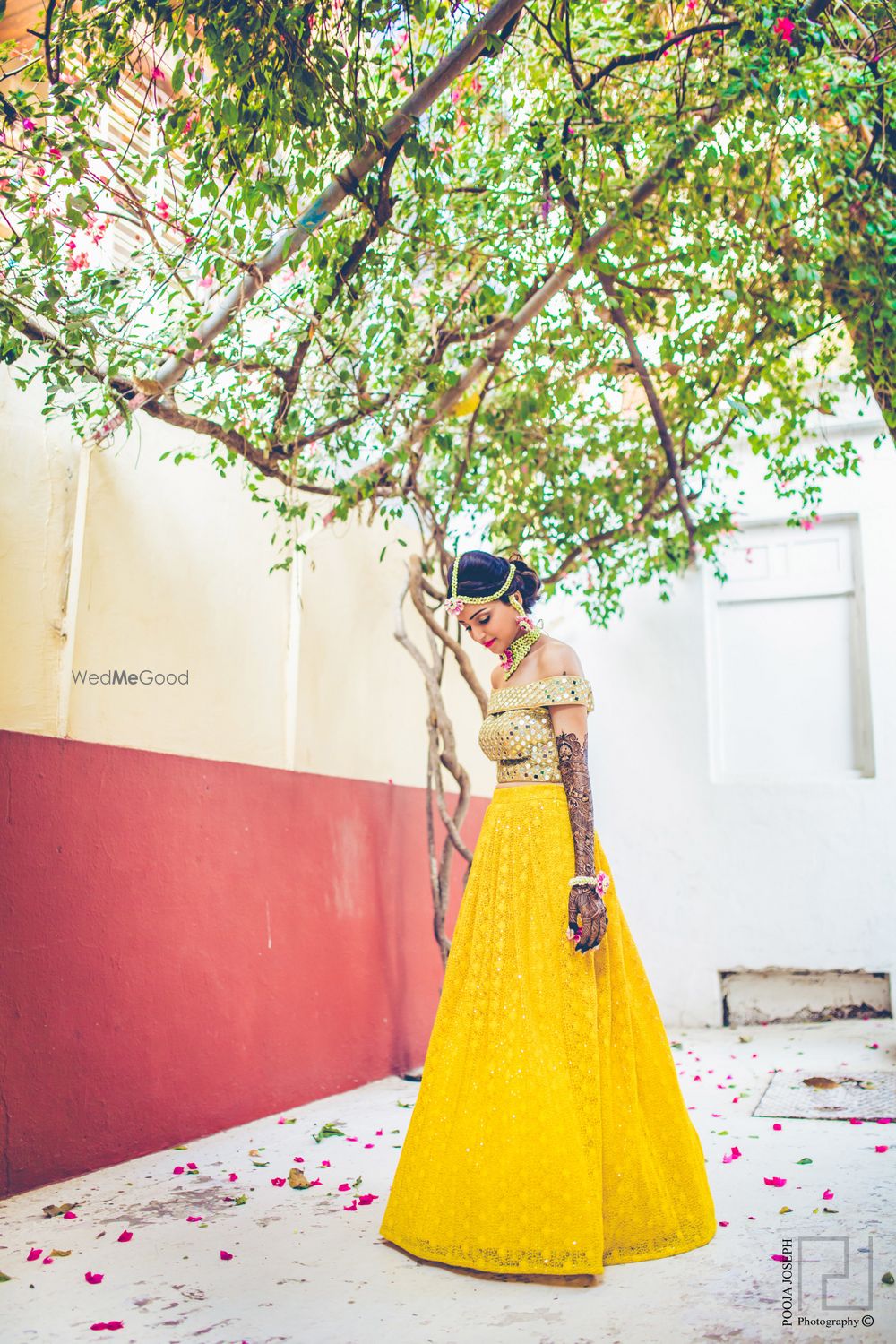 Photo of Gold off-shoulder blouse with mirror work and yellow skirt