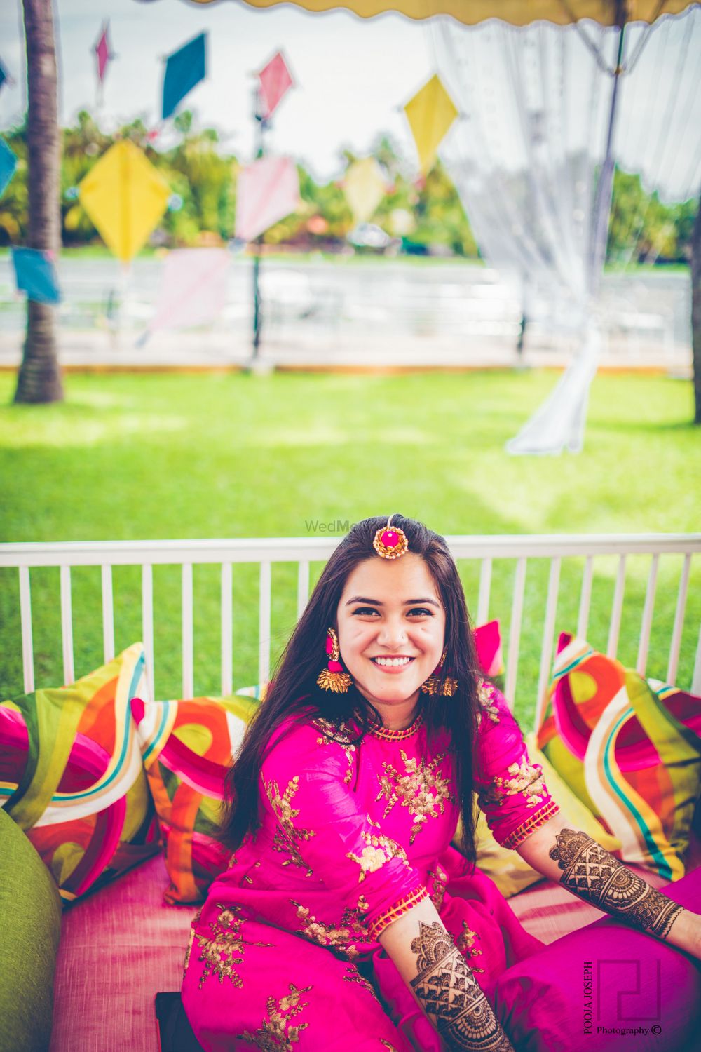 Photo of Bride on mehendi day in pink outfit