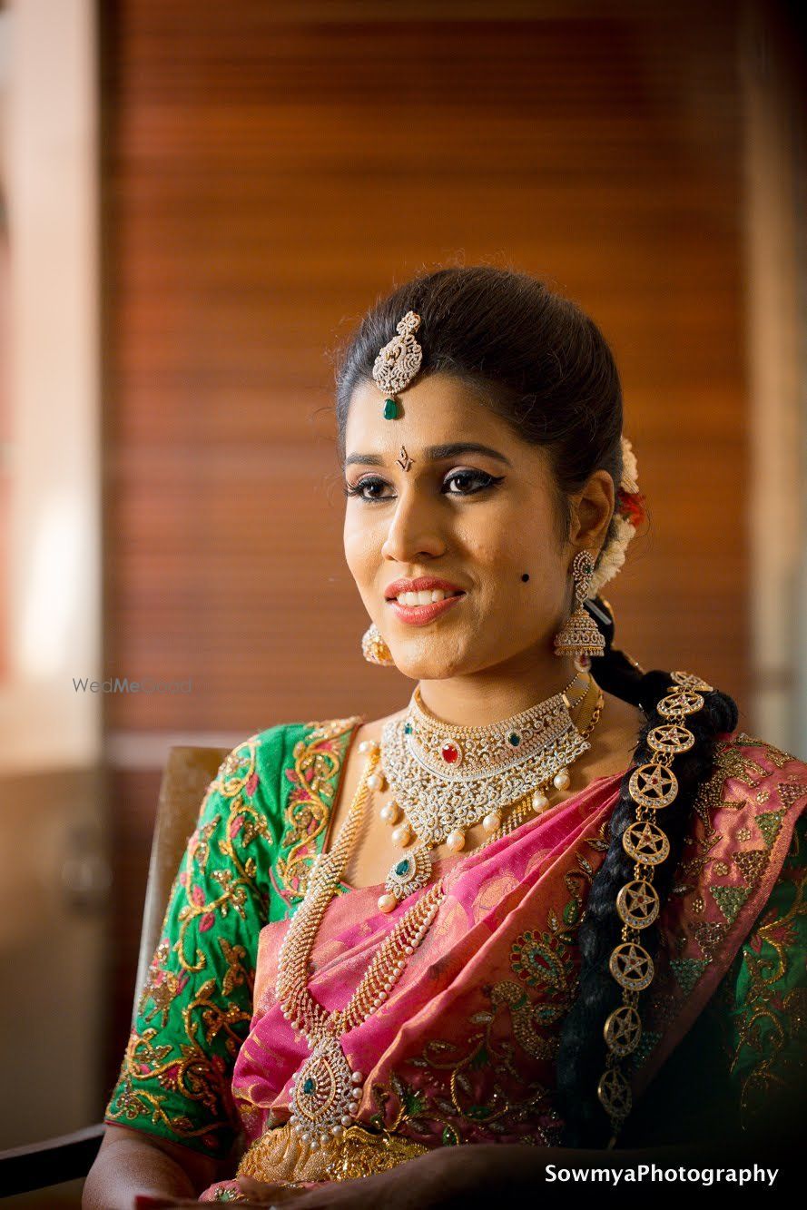 Photo of A south Indian bride in a saree with stunning gold and diamond jewellery