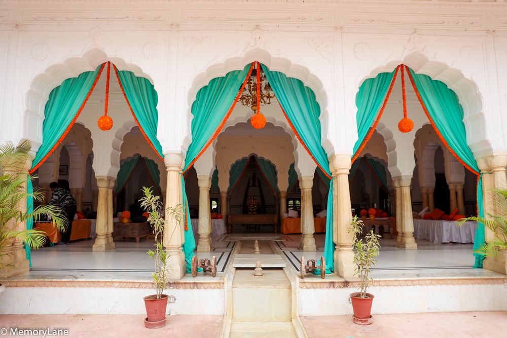 Photo of turquoise and orange drapes decor for mehendi