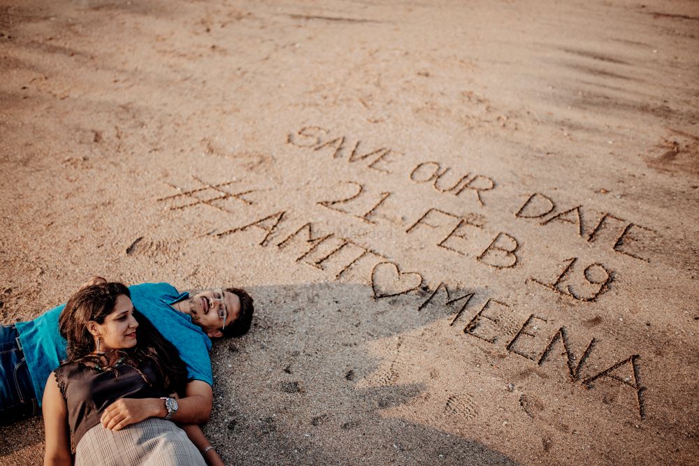 Photo of Cute save the date idea at the beach written on sand