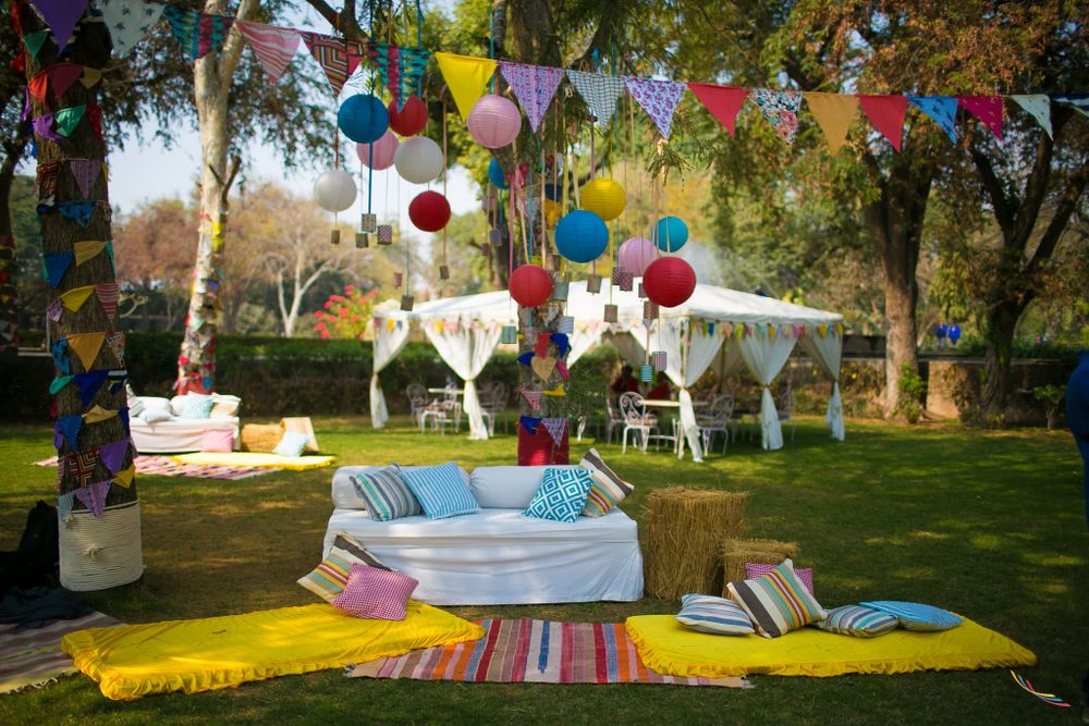 Photo of Day Mehendi Decor with Colorful Flags and Hanging Balls