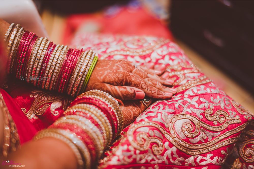 Photo of Red and Gold Bangles with Gold Embroidery on Lehenga