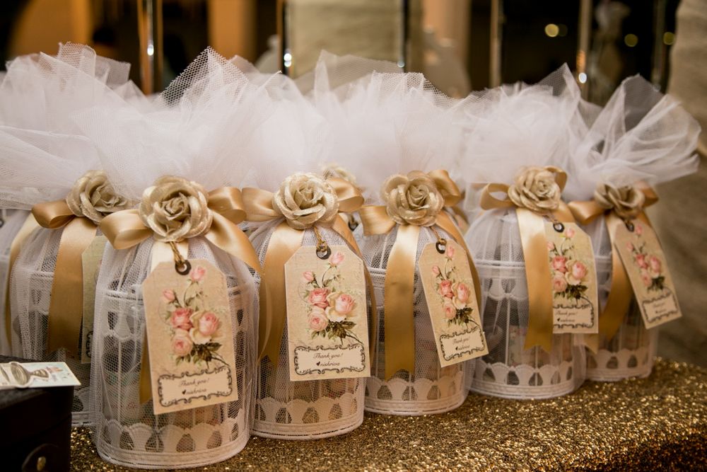 Photo of Bird Cage Gold and White Favors
