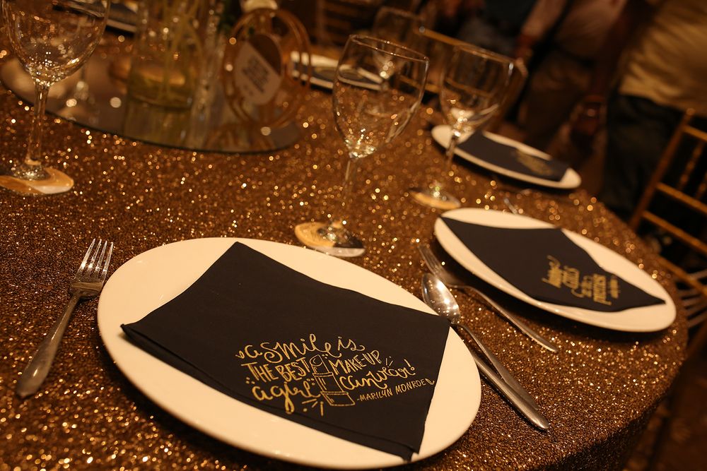Photo of Gold Glitter Table Decor with Customised Serviettes