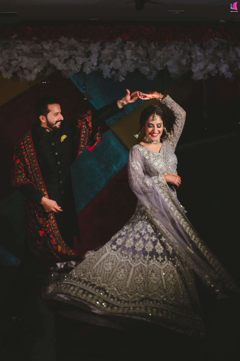 Photo of dancing couple twirling bride shot on engagement