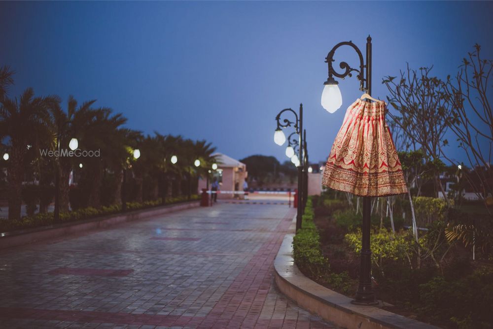 Photo of Gold Bridal Lehenga on a Lamp Post