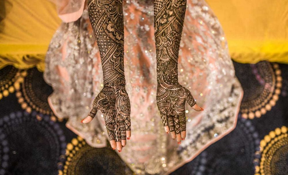 Photo of Full hand traditional mehndi design.