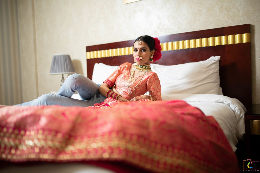 Photo of bride with lehenga on her bed shot before getting ready