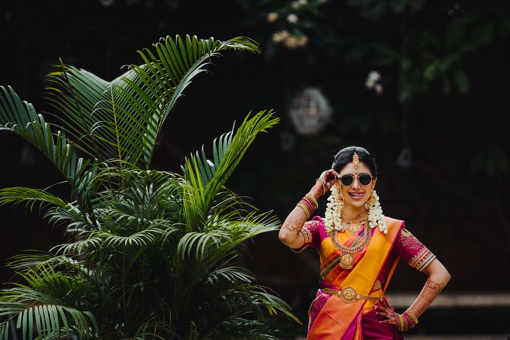Photo of cool south indian bridal shot wearing sunglasses