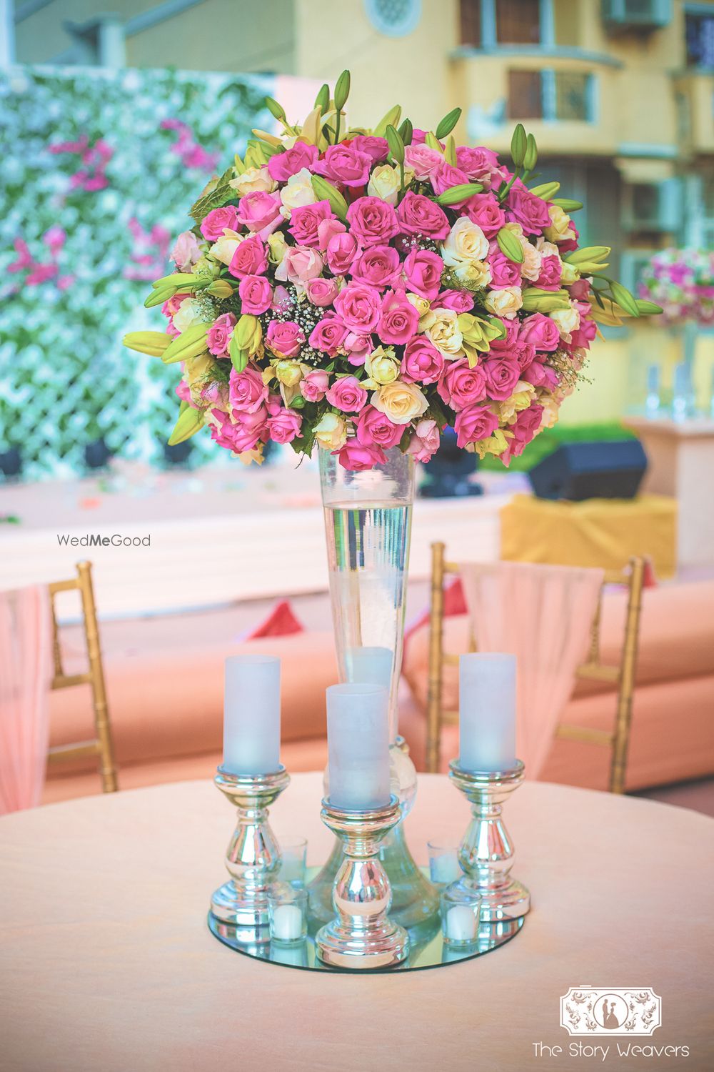 Photo of Pink and Yellow Floral with Candles Table Decor