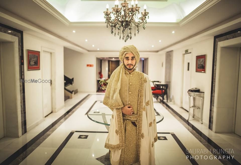 Photo of Gold Sequins Sherwani with White and Gold Dupatta