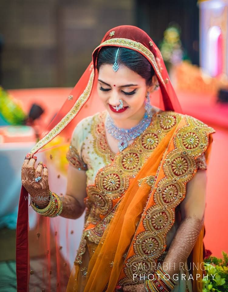 Photo of Orange and Red Bride Portrait