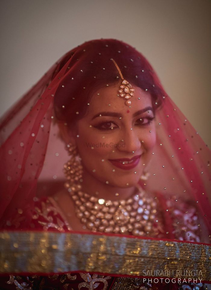 Photo of Bride with Veil - Red Net Dupatta