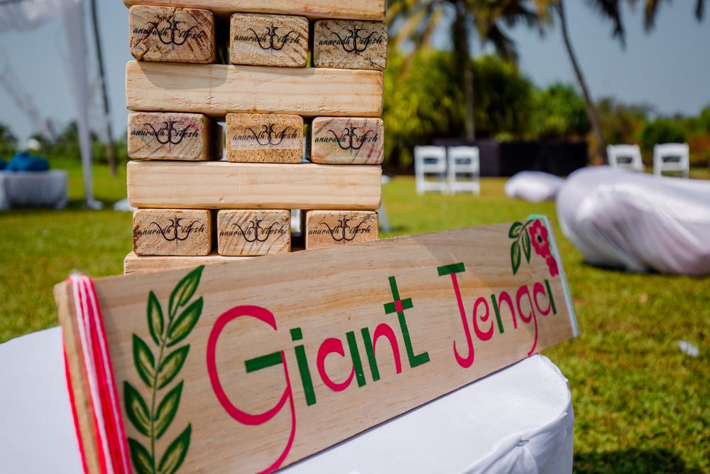 Photo of giant jenga mehendi game idea for beach wedding