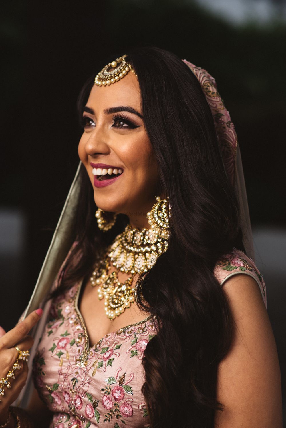 Photo of happy bride shot with open hair and simple makeup