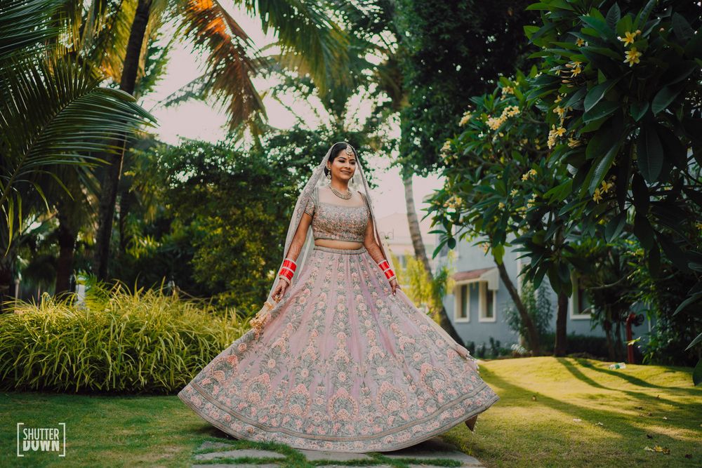 Photo of minimal pastel bridal lehenga for destination wedding