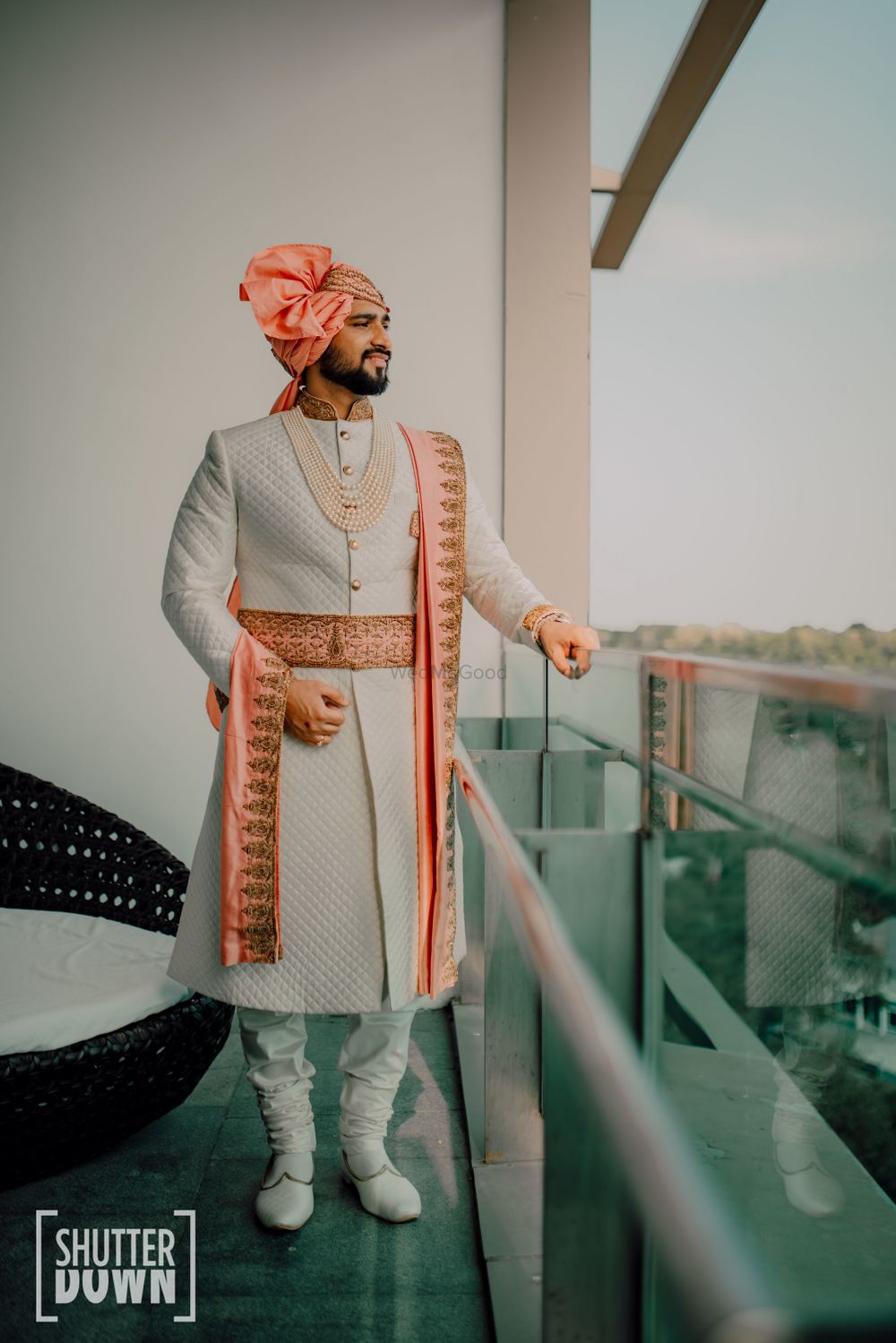 Photo of off white sherwani with peach stole and waistbelt