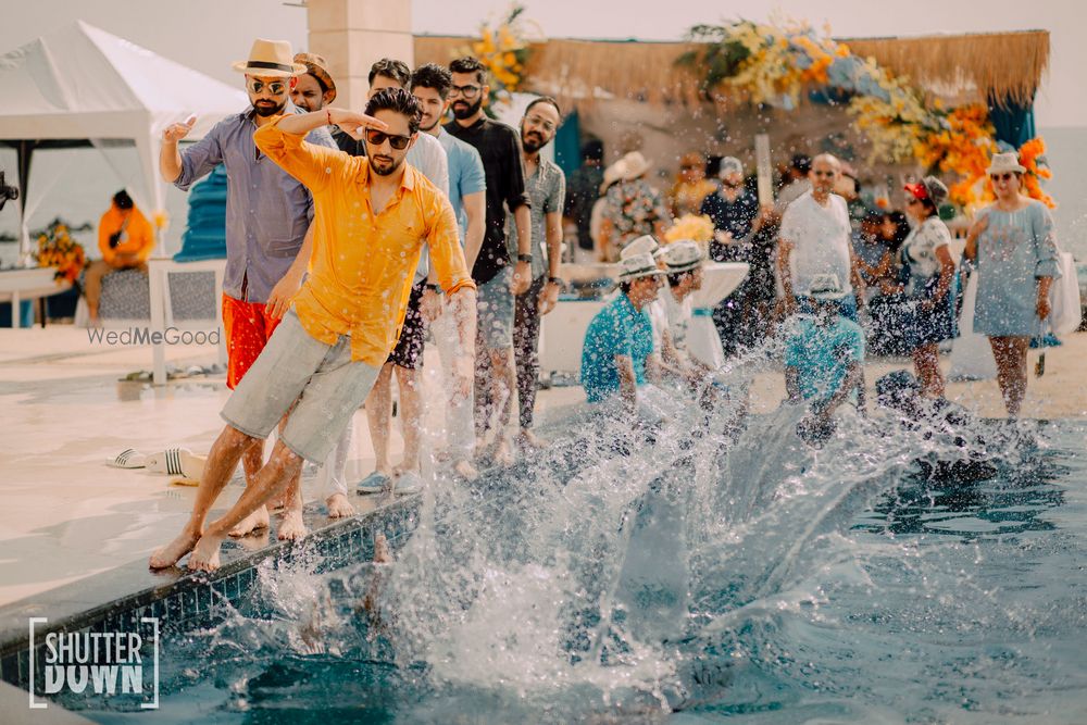 Photo of pool party fun shot for destination wedding