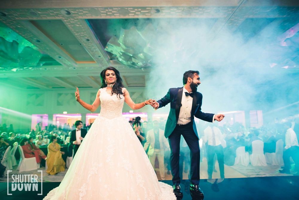 Photo of couple dancing shot on cocktail or sangeet