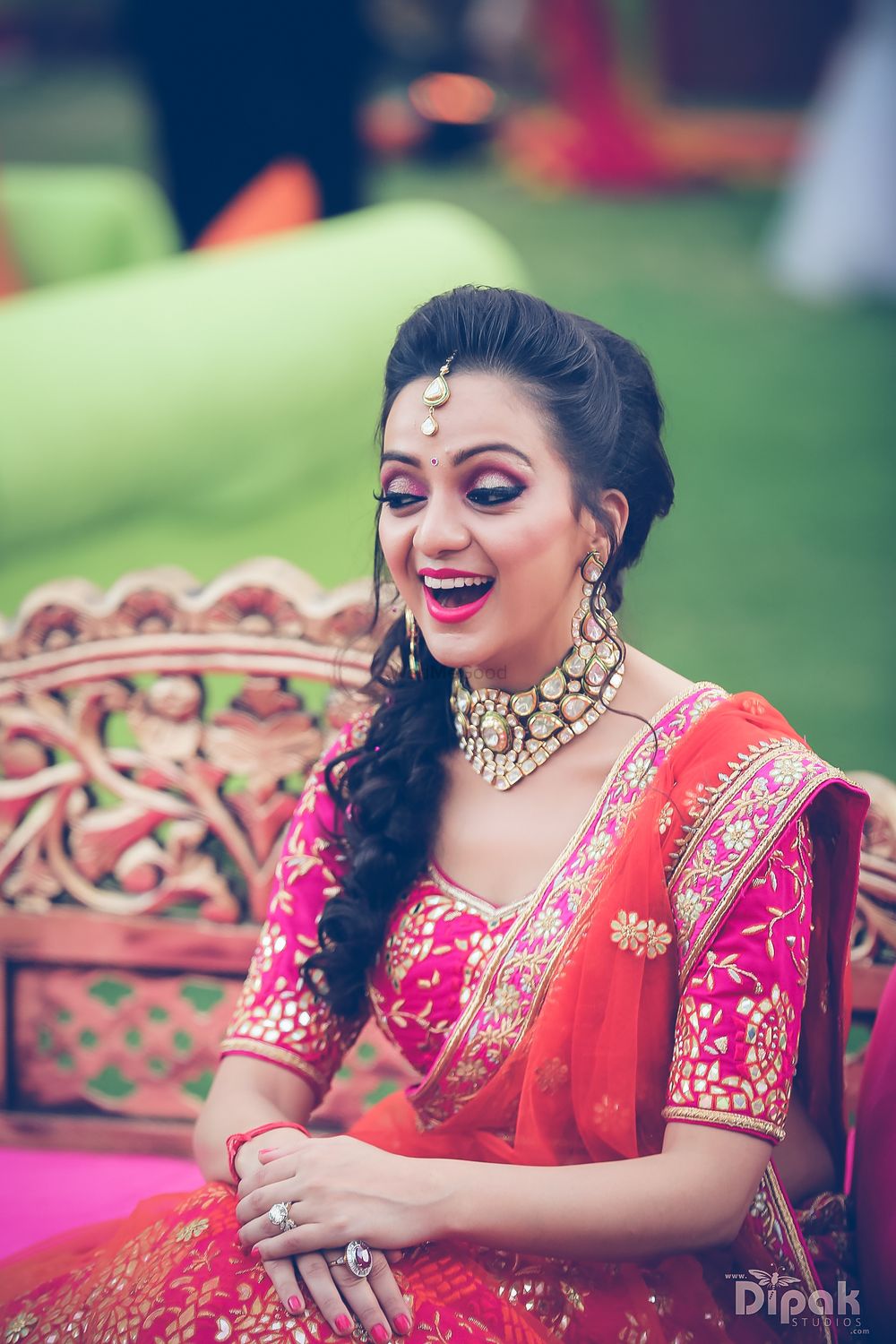 Photo of Bride wearing fucschia pink and orange