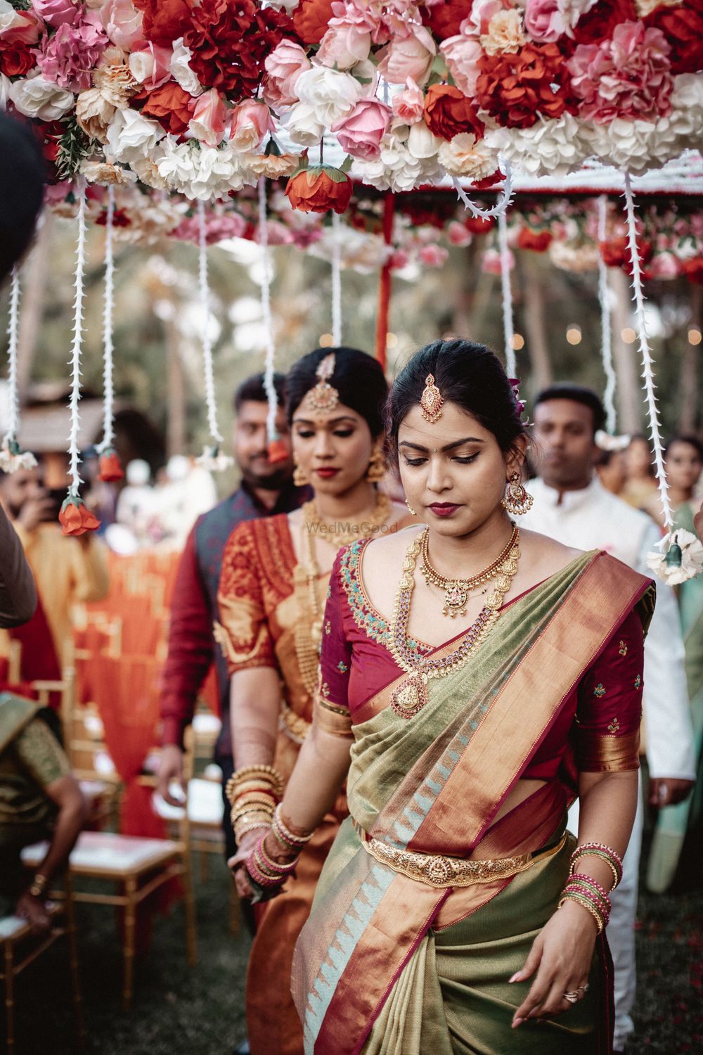 Photo of south indian bridal entry under phoolon ki chadar