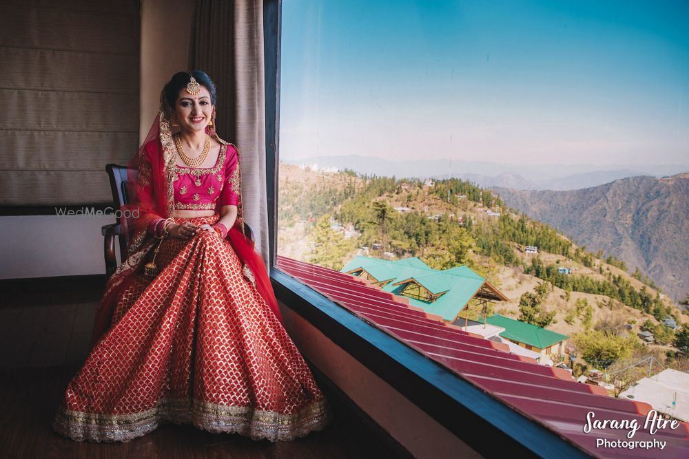 Photo of bridal portrait in a simple red banarasi lehenga