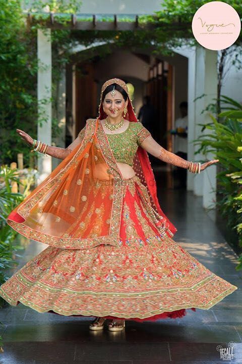 Photo of Carrot Red and Parrot Green Twirling Lehenga
