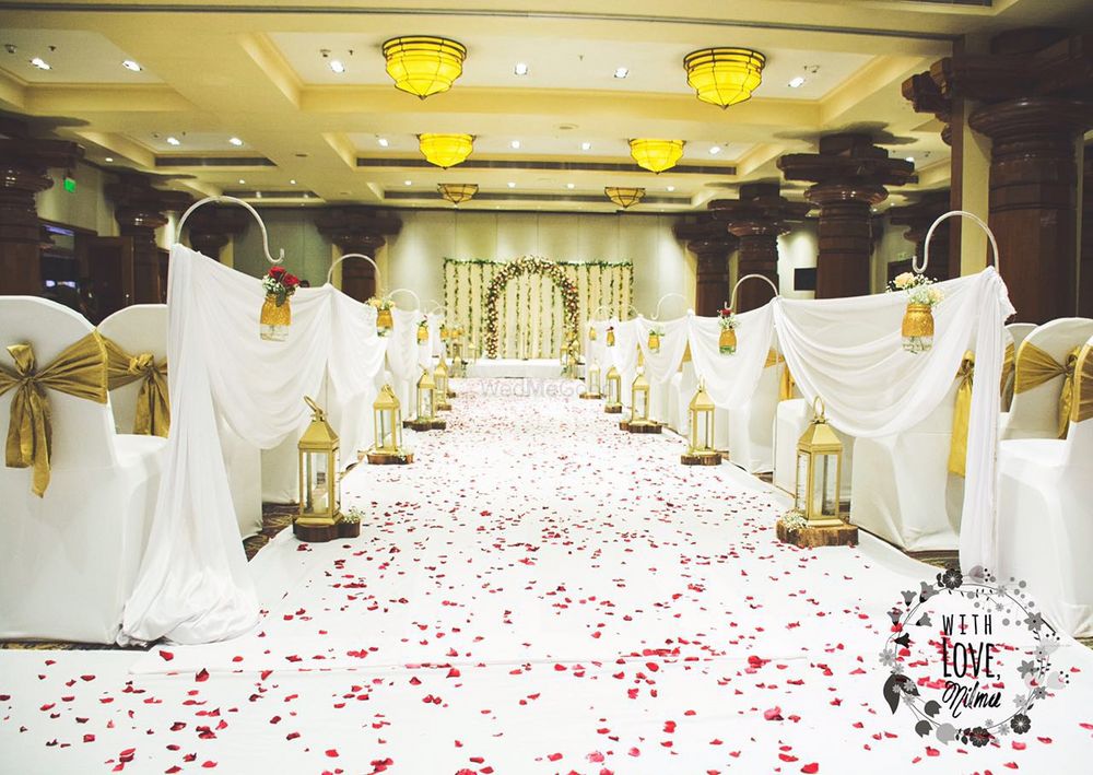 Photo of White Entrance with Flower Petals Decor