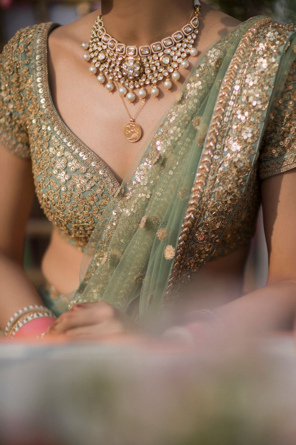 Photo of simple layered bridal necklace and blouse