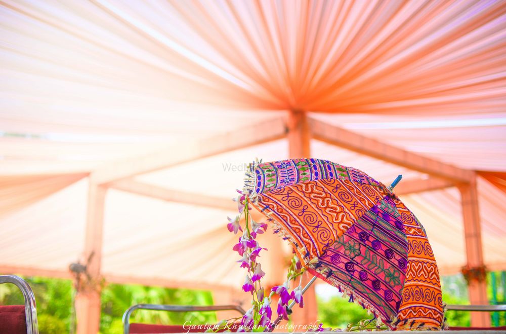 Photo of Peach Canopy Tents and Colorful Umbrella Decor