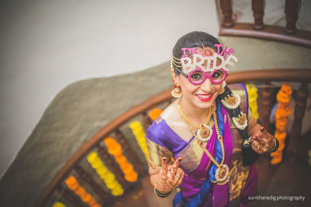 Photo of south indian bride wearing prop glasses