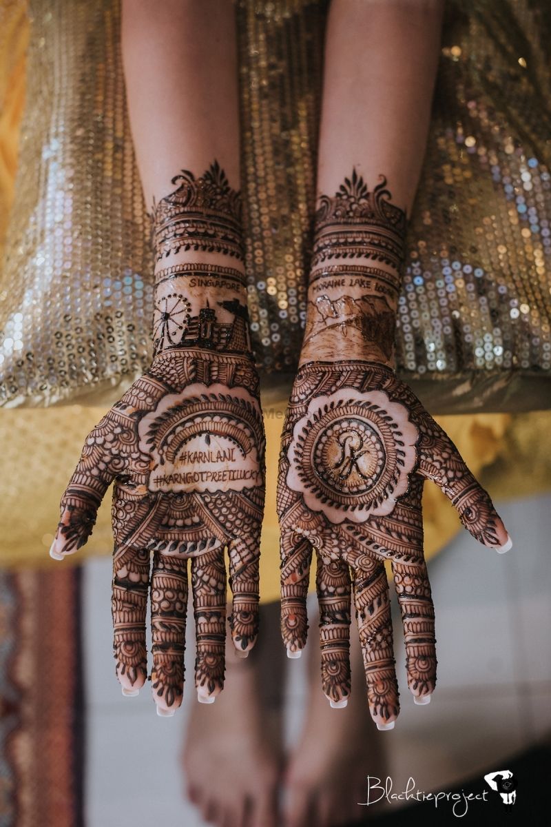 Photo of unique personalised bridal mehendi with hashtag