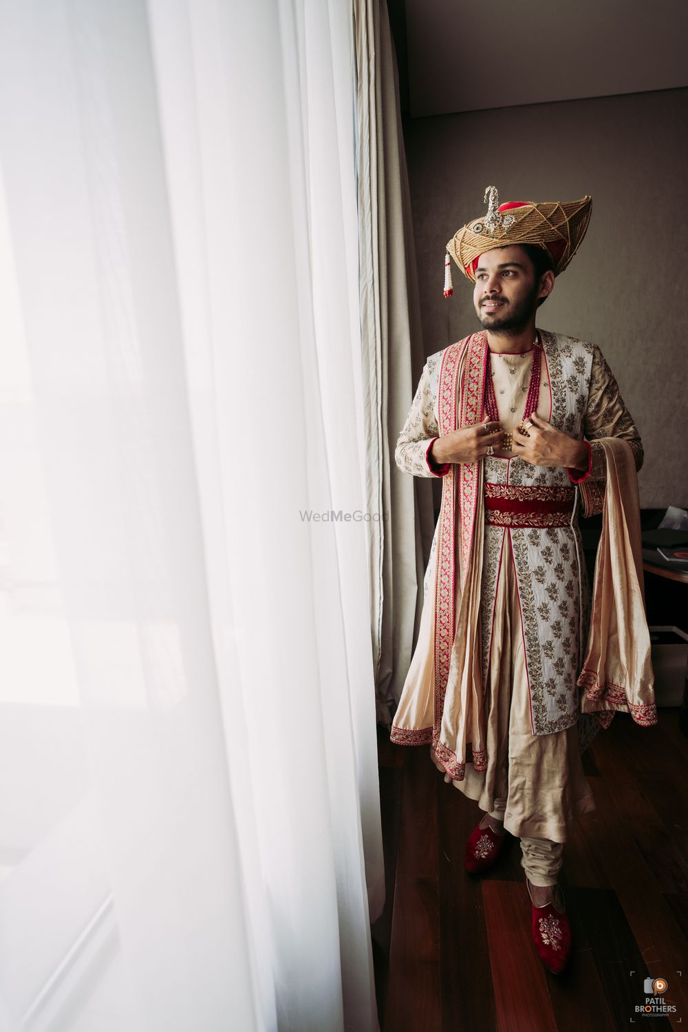 Photo of Groom in an off-white embroidered sherwani.