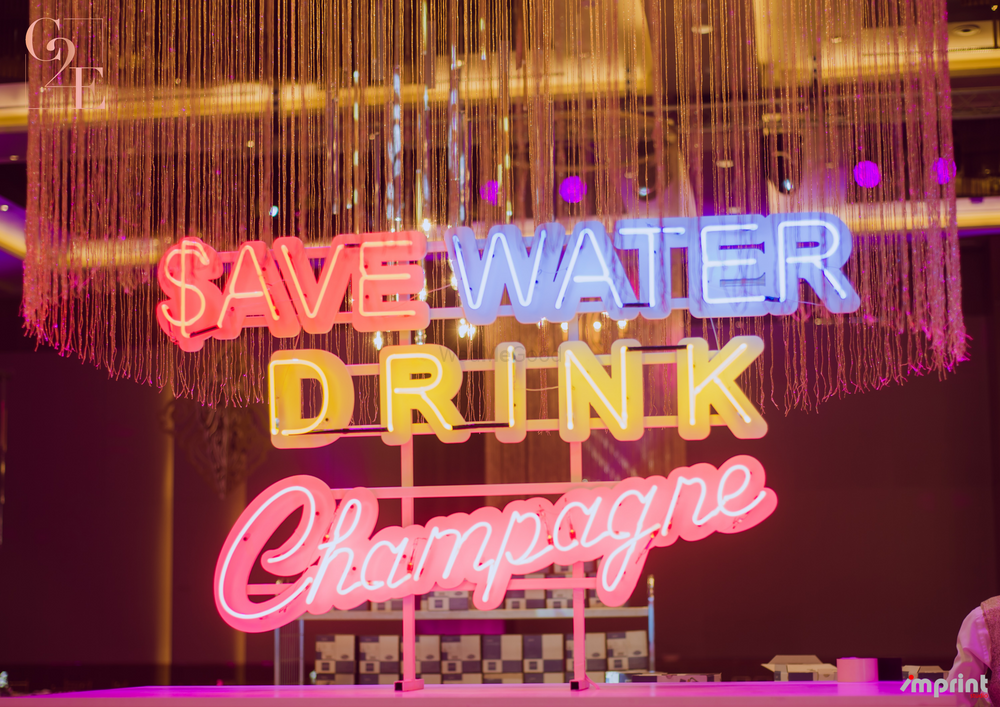 Photo of neon bar decor with saying