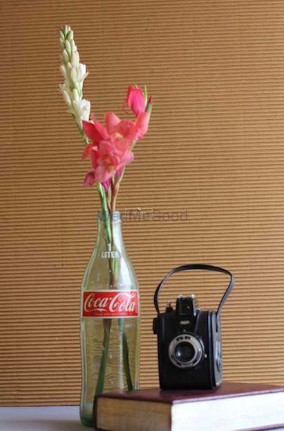 Photo of Coca Cola Bottle Centerpiece with Vintage Camera