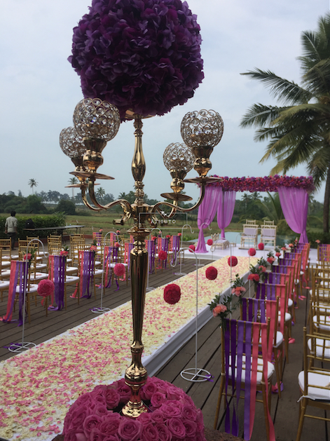 Photo of Gold Candelabras with Purple and Pink Decor
