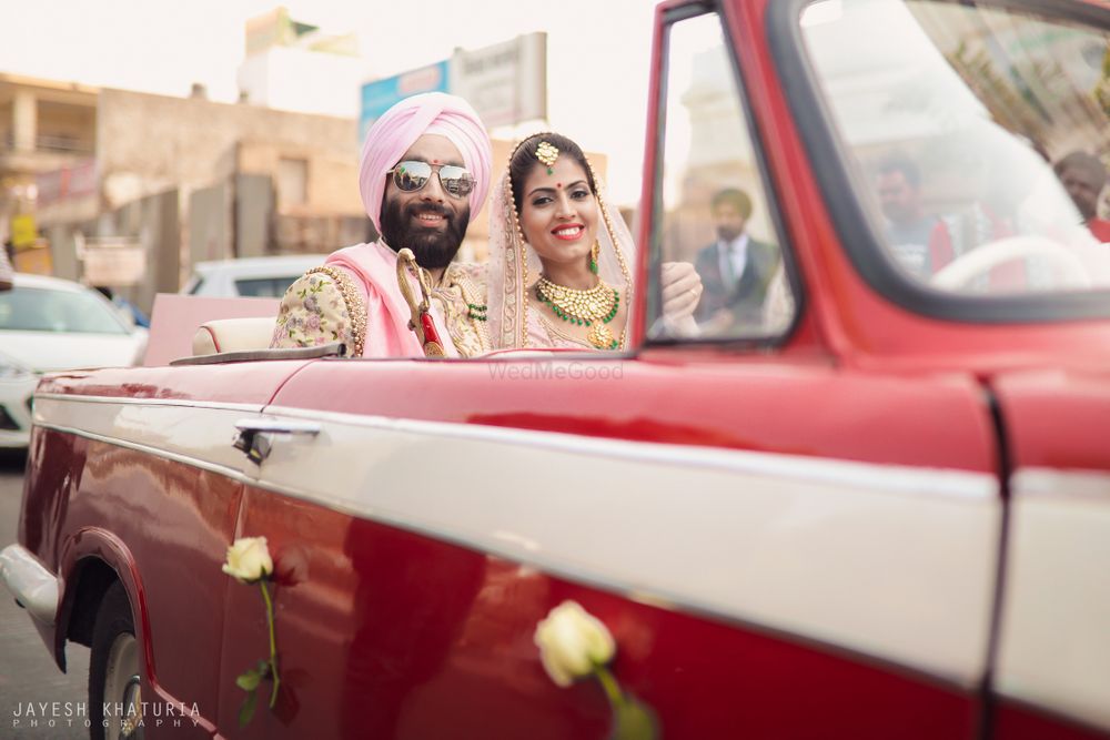 Photo of couple entry or exit idea in vintage car