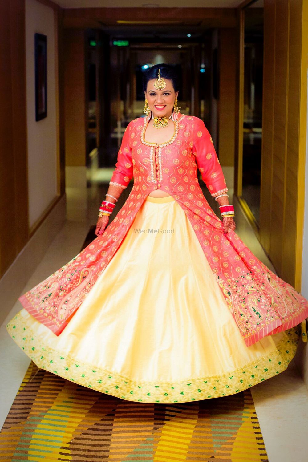 Photo of Coral Red and Light Yellow Twirling Lehenga